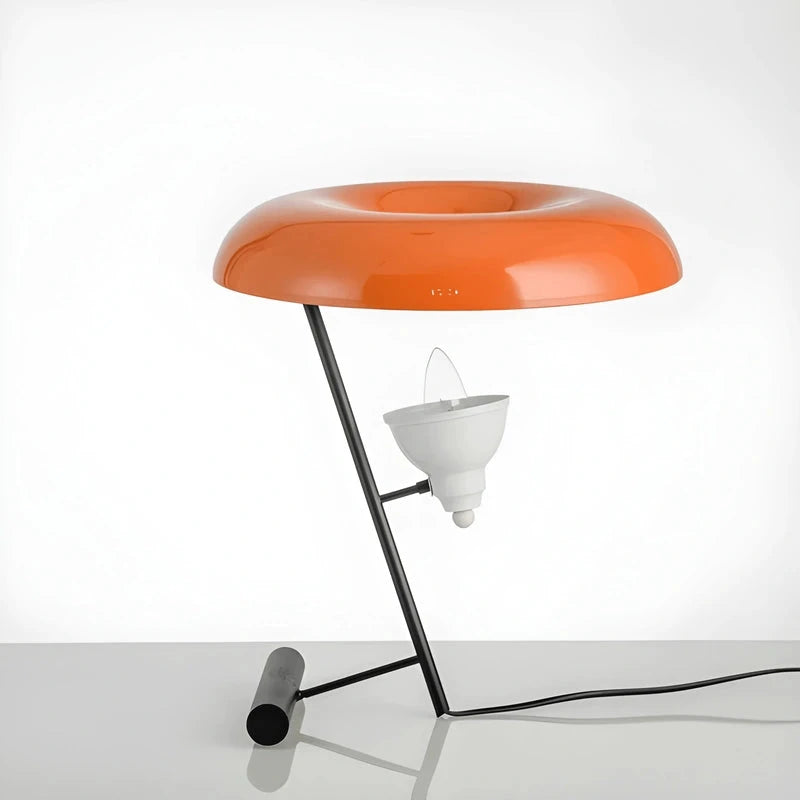 Lampe de bureau vintage orange sur un bureau en verre