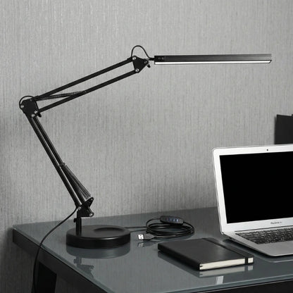 Lampe de Bureau Articulée en Métal sur un bureau en verre
