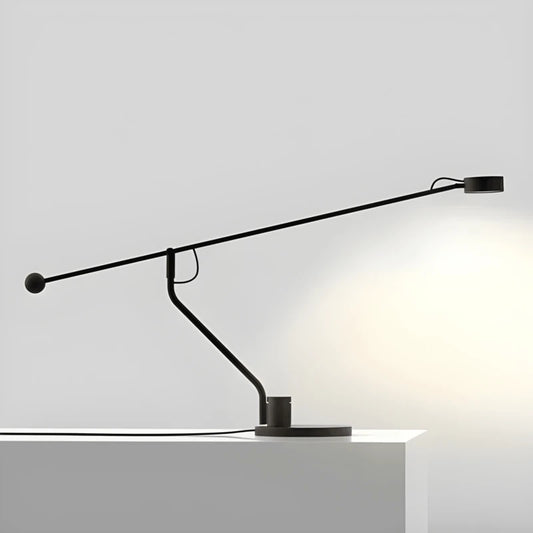 Lampe de Bureau Articulée Milano au-dessus d'un espace lecture blanc & simpliste